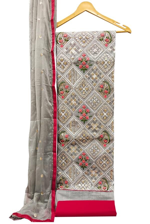Exude elegance and sophistication with this stunning Grey Embroidered Floral Chanderi Dress Material with Dupatta. Crafted for the modern woman who appreciates classic style with a refined touch, this unstitched suit set features delicate floral embroidery on premium Chanderi fabric, making it a versatile choice for festive events, office wear, or graceful daily wear.Top Material: Premium Chanderi fabric in a graceful grey tone, intricately adorned with floral thread embroidery that adds charm, texture, and artisanal beauty to the ensemble.Bottom Material: Coordinated cotton or Chanderi blend fabric offering soft comfort and seamless styling with the top.Dupatta: Elegant Chanderi dupatta featuring complementing embroidery or subtle printed accents with a bordered finish, completing the look with airy elegance.Key Features:Fabric: Chanderi (Top & Dupatta), Cotton/Chanderi Blend (Bottom)Work: Delicate Floral EmbroideryColor: Soft Grey with Multi-thread Embroidered MotifsType: Unstitched — can be tailored into various ethnic suit stylesOccasion: Ideal for festive wear, formal gatherings, cultural events, and everyday sophisticationCare: Dry clean recommended to maintain the embroidery and fabric textureFabric Length:Top: Approx. 2.5 metersBottom: Approx. 2.5 metersDupatta: Approx. 2.25 meters