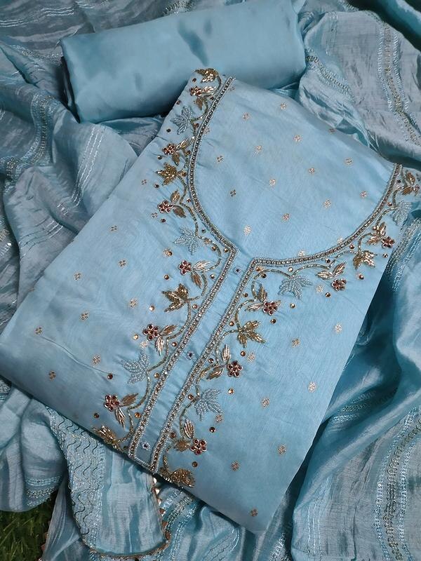 Add a refreshing charm to your ethnic collection with this beautifully crafted firozi color dress material featuring delicate butti handwork. The cool and calming firozi (turquoise blue) shade paired with intricate handcrafted motifs gives it a graceful yet vibrant look, perfect for festive gatherings, casual outings, or traditional celebrations.Key Features:Top Fabric: Premium cotton/silk/chanderi (as applicable)Work: Intricate hand-embroidered butti workColor: Elegant Firozi (Turquoise Blue)Bottom Fabric: Coordinated or contrasting plain/embroidered fabricDupatta: Matching or contrast dupatta with light handwork or borderOccasion: Festive wear | Semi-formal events | Traditional gatheringsHighlights:Refreshing and elegant firozi toneDelicate butti hand embroidery for a timeless ethnic lookUnstitched material allows for personalized tailoringLightweight and comfortable for all-day wearStep into style with this vibrant firozi ensemble — where tradition meets sophistication.