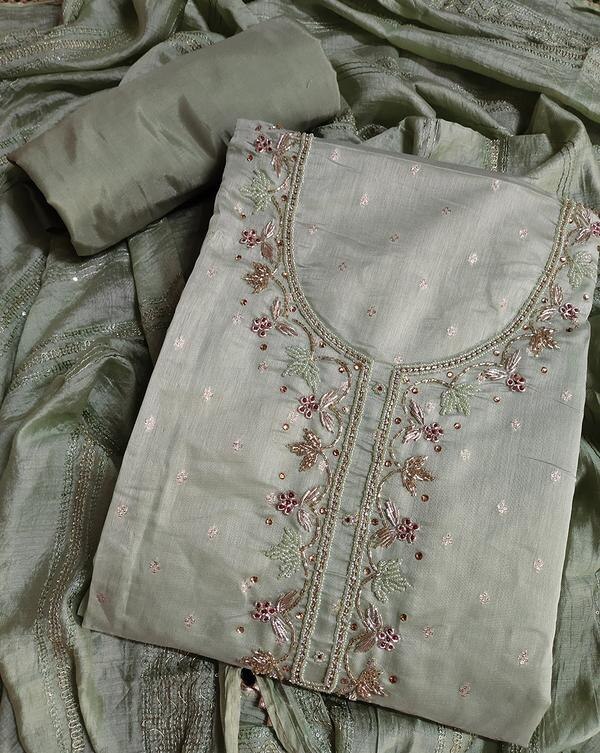 Step into timeless elegance with this mehendi green butti handwork dress material, designed for those who appreciate the beauty of tradition. The earthy and elegant mehendi (henna) shade brings a soothing, festive charm, while the hand-embroidered butti motifs add intricate detailing and artisanal finesse. Perfect for ethnic events, poojas, festive gatherings, or everyday graceful wear.Key Features:Top Fabric: High-quality cotton/silk/chanderi (as applicable)Work: Fine hand-embroidered butti work throughoutColor: Mehendi Green – a soft, earthy green toneBottom Fabric: Matching or contrasting plain/embroidered fabricDupatta: Coordinated dupatta with light embroidery or woven detailingOccasion: Festive wear | Ethnic gatherings | Casual traditional lookHighlights:Unique and calming mehendi green toneHandcrafted butti embroidery for an elegant, traditional lookUnstitched fabric for a personalized fitLightweight, breathable, and comfortable
