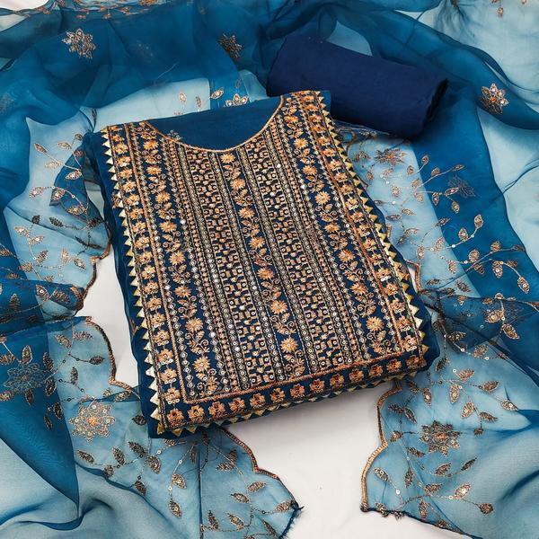 Elevate your ethnic wardrobe with this stunning Blue Embroidery Dress Material with Dupatta, a perfect blend of traditional elegance and modern craftsmanship. The unstitched fabric set features intricate embroidery work on a rich blue base, designed to turn heads at every festive occasion or celebration.Crafted from premium-quality fabric, this dress material offers unmatched comfort and style. The beautifully embroidered top pairs effortlessly with a matching dupatta and bottom fabric, allowing you to tailor the ensemble to your personal fit and design.Whether you're attending a wedding, festival, or special event, this timeless piece ensures you look graceful and poised.📦 Product Details:Top Fabric: [e.g., Georgette / Cotton / Chanderi] with detailed embroideryBottom Fabric: [e.g., Santoon / Cotton / Crepe] (Unstitched)Dupatta: Matching [e.g., Net / Chiffon / Organza] with border or embroideryColor: Royal Blue / Navy Blue / Sky Blue (choose actual shade)Work: Thread / Zari / Sequins EmbroideryStyle: Traditional | Party Wear | Festive LookType: Unstitched Dress MaterialWash Care: Dry Clean for first wash recommended💫 Key Highlights:Elegant embroidery for a premium ethnic lookSoft, breathable fabric ideal for all-day wearCustomizable fit – perfect for tailoring to your size and styleComes with a beautifully coordinated dupatta