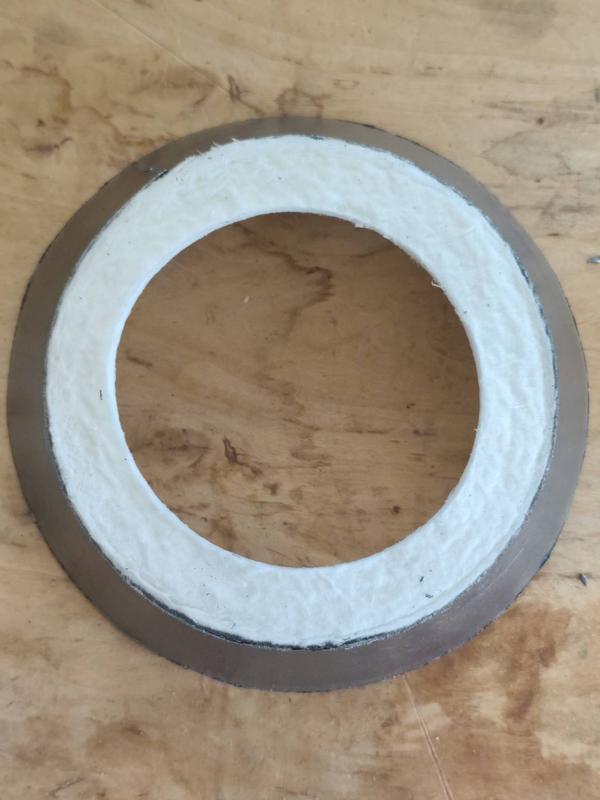 Product Description: Graphite-Normal Ceramic Fiber GasketThe Graphite-Normal Ceramic Fiber Gasket is a high-performance thermal sealing component designed for use in ladle shrouds, slide gates, and other high-temperature industrial applications. This gasket combines normal ceramic fiber insulation with a graphite surface layer to ensure optimal thermal resistance and sealing integrity under extreme conditions.Structure:Core Material: Normal-grade ceramic fiber (lightweight and thermally insulating)Surface Layer: Flexible graphite sheet (for improved sealing and durability)Shape: Ring/Donut type; available with flat or beveled edgesTechnical Features:Temperature Resistance: Up to 1000°CApplication Specificity: Engineered for use in ladle shrouds, slide gate refractory systems, and tundish nozzlesThermal Insulation: Low thermal conductivity with excellent resistance to heat shockSealing Capability: Graphite layer provides improved gas-tight seal under mechanical stressApplications:Ladle ShroudsSlide Gate ValvesTundish-Ladle ConnectionContinuous Casting Machines (CCM)Furnace Door SealsAdvantages:Enhanced sealing from graphite coatingStable under thermal cycling and molten metal contactLightweight, easy to handle and installAvailable in customizable sizes for precise fitAvailable Sizes:Inner & Outer Diameter: As per design/spec requirementThickness Range: 3 mm to 25 mm or custom
