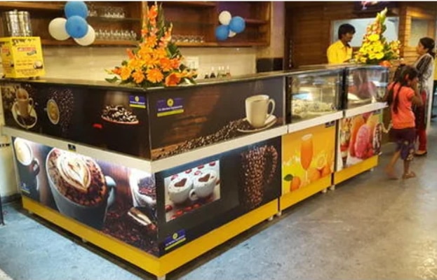 Usage/Application	RestaurantBrand	SL Kitchen EquipmentCounter Shape	RectangularNo. Of Shelves	2 ShelvesHeight	3-4 FeetMaterial	Stainless SteelSS COFFEE AND TEA DISPLAY COUNTER WITH TOP GLASS AND GRANITE FRONT STICKER  DESIGN