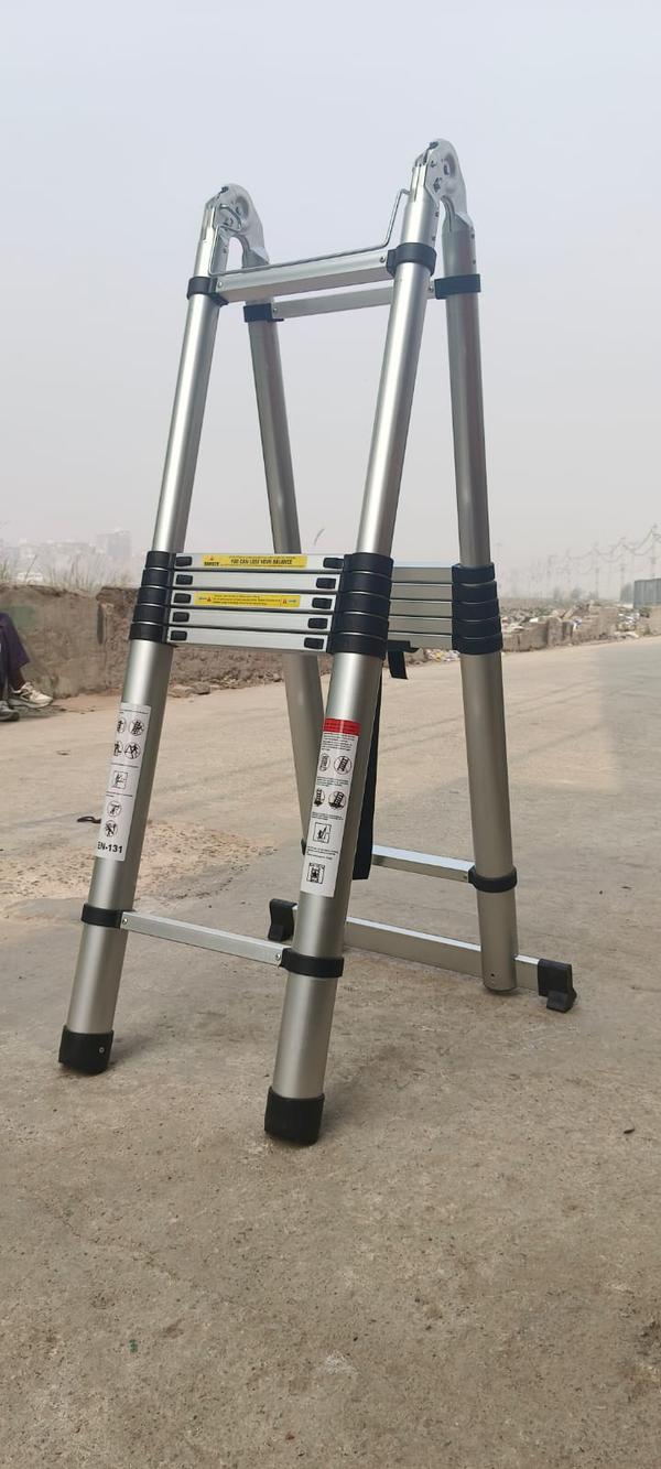 telescopic self-support ladder is a versatile, free-standing ladder designed with an A-frame structure that offers both stability and adjustable height for a wide range of tasks. Unlike standard telescopic ladders that lean against a surface, this type of ladder supports itself, making it ideal for use in open spaces or areas without wall access.Key Features:Telescopic Mechanism: Each side of the ladder extends and locks in place using a smooth sliding telescoping system, allowing for flexible height adjustment.Self-Supporting A-Frame Design: Offers excellent stability without needing to lean against a wall, suitable for both indoor and outdoor use.Dual-Side Access: Many models allow climbing from both sides, ideal for two-person use in professional settings.Compact & Portable: Folds down to a compact size for easy storage and transport; perfect for those with limited space.Durable Build: Constructed from high-strength aluminum alloy or fiberglass for a lightweight yet sturdy frame.Safety Features:Secure locking mechanisms on each rungAnti-slip rubber feet for enhanced gripReinforced hinge joints and stabilizer bars for added supportAdjustable Height: Common models extend from around 2.5 feet to 12 feet (0.75 m to 3.6 m), depending on the configuration.Typical Uses:DIY and home improvement tasksElectrical and maintenance workIndoor tasks like changing ceiling lights or accessing high shelvesOutdoor jobs such as hedge trimming or paintingALUMINIM SELF SUPPORT TELESCOPIC LADDER - 10+10