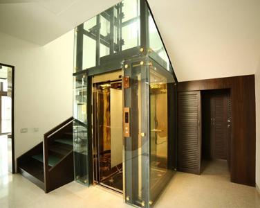 Bungalow lift ManufacturersWe are also supply in Andhra Pradesh, Arunachal Pradesh, Assam, Bihar, Chhattisgarh, Goa, Gujarat, Haryana, Himachal Pradesh, Jharkhand, Karnataka, Kerala, Madhya Pradesh, Maharashtra, Manipur, Meghalaya, Mizoram, Nagaland, Odisha, Punjab, Rajasthan, Sikkim, Tamil Nadu, Telangana, Tripura, Uttar Pradesh, Uttarakhand, and West BengalBungalow lift ManufacturerInstalling an elevator (lift) in a bungalow is less common than in multi-story buildings, as bungalows are single-story homes. The need for an elevator is typically associated with structures that have multiple floors.However, there are some cases where individuals with mobility challenges or disabilities may choose to install a residential elevator in a single-story home like a bungalow. This can provide easier access to different parts of the house without the need for stairs. These residential elevators for single-story homes are often smaller and more compact than those found in larger buildings.If you're considering installing an elevator in a bungalow lift, it's important to consult with a professional contractor or an elevator specialist to assess the feasibility, cost, and any necessary modifications to your home's structure. Additionally, you may need to check local building codes and regulations to ensure compliance with safety standards and obtain any required permits.