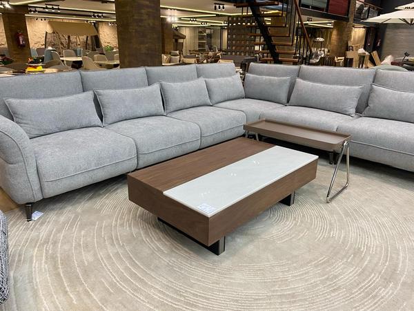 Introducing our beautifully crafted 9-seater sofa, proudly made in-house with exceptional attention to detail and quality. This spacious and elegant piece is upholstered in premium jute fabric, offering a natural texture and timeless appeal. Designed to accommodate large families or gatherings, it combines durability with comfort through its sturdy structure and generous seating. Ideal for luxurious living rooms or spacious lounges, this sofa reflects fine craftsmanship and a refined aesthetic. Its earthy tone and modern silhouette make it a perfect centerpiece for any contemporary home.