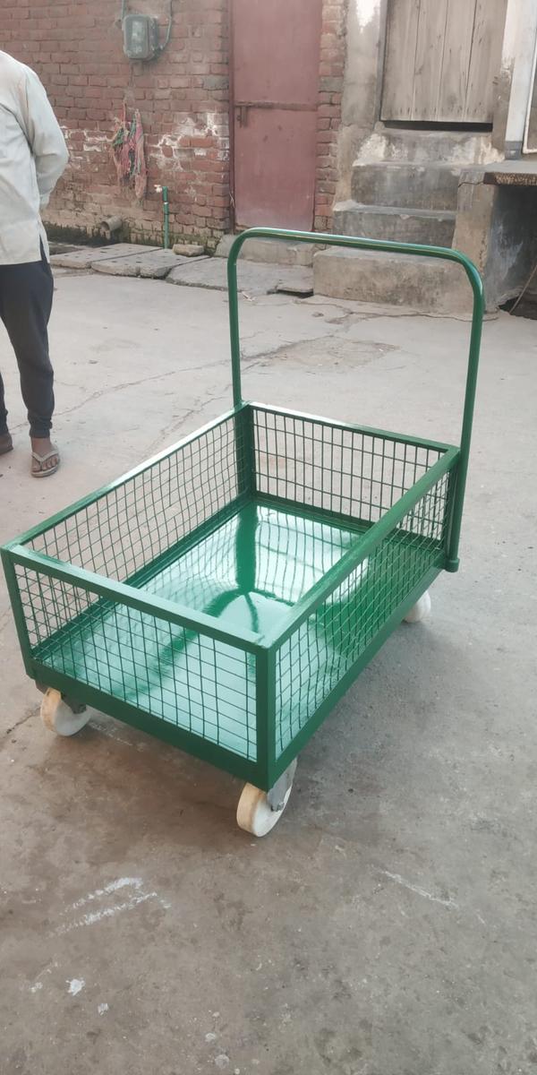 MS trolley refers to a Mild Steel (MS) material handling trolley, designed for transporting goods, tools, equipment, or materials efficiently and safely in industrial, commercial, or institutional settings. These trolleys are known for their strength, durability, and load-bearing capacity.Key Features:Material:Constructed from Mild Steel (MS), offering high structural strength.Usually coated with powder coating or paint for rust resistance and durability.Design:Available in various configurations: flatbed, platform, cage, two/three/four-shelf types, or customized designs.Frame construction is often welded or bolted, designed to handle heavy-duty loads.Handles may be push/pull type, fixed or detachable.Mobility:Fitted with heavy-duty caster wheels (fixed or swivel, with or without brakes).Wheels may be rubber, PU, or nylon, depending on the floor type and application.Load Capacity:Typically ranges from 100 kg to 1000+ kg, depending on design and construction.Reinforced decks or frames available for higher capacity needs.Surface:Can be plain, perforated, or with anti-slip mats.Some versions include side rails, mesh enclosures, or bins for load containment.Customization Options:Options for number of shelves, dimensions, wheel type, and color.May include locking systems, drawers, or tool holders.Common Applications:Industrial warehouses and factories for material transportWorkshops and garages for tool and parts handlingHospitals, hotels, and commercial kitchens (custom MS trolleys with stainless top)Retail and logistics centersSIZE - 2/2.5