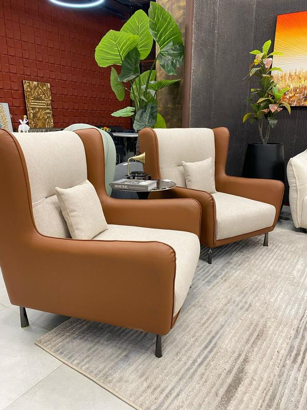 Here’s presenting our premium manufacture 2-piece armchair set, designed to bring elegance and comfort to your living space. Crafted with precision, these chairs feature a sophisticated combination of light cream and rich brown tones, perfectly blending with both modern and classic interiors. The plush cushioning ensures a relaxing seating experience, while the timeless design adds charm to any room. A true statement of luxury, these armchairs are perfect for elevating your home’s ambiance.