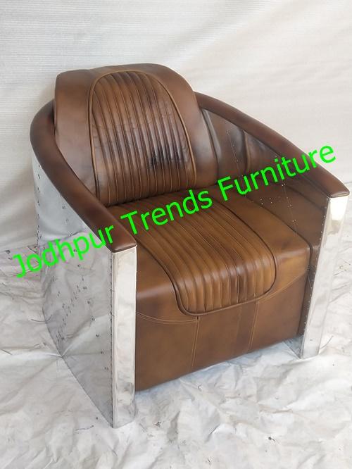 The Aviator Armchair is a distinctive piece of furniture inspired by the design and materials of vintage aviation, particularly World War II fighter planes like the Spitfire or P-51 Mustang.The outer shell is typically made from riveted aluminum panels, mimicking aircraft fuselage construction.Curved or semi-barrel shape that cradles the body—sometimes with flared armrests and a deep seat.