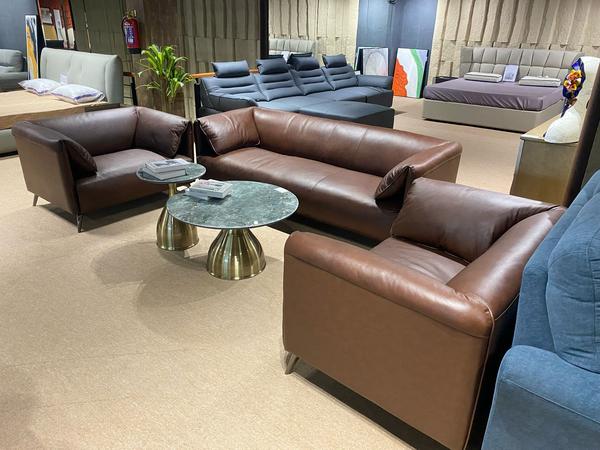 Presenting our imported 3+1+1 sofa set, a perfect blend of elegance and comfort for your living space. Crafted with premium materials, this exquisite set features a timeless design that complements both modern and classic interiors. Its plush seating ensures unmatched comfort, while the fine detailing adds a luxurious charm. Ideal for creating a warm yet sophisticated ambiance, this sofa set is a statement of style and quality for your home.