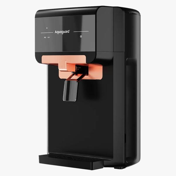 Bring home the perfect combination of RO + UV purification for double protection and safe, great-tasting water. With advanced features like E-Boiling™ technology, an SS storage tank, and a convenient removable drip tray, this purifier is designed for both performance and ease of use.Specifications:Brand: AquaguardType: RO + UVStorage: 8 Litre Stainless Steel TankPurification Capacity: 15 Litres/HourTechnology: E-Boiling™ – ensures water as safe as boiled waterConvenience: Removable Drip Tray for easy cleaningMaximum Duty Cycle: 40 Litres/DayPower: 40 VDCMode: Auto Cutoff – prevents overflow & conserves energyAvailable Colour: BlackHighlights:✅ Dual purification (RO + UV) for 100% safe drinking water✅ E-Boiling™ technology for advanced protection✅ Durable 8L stainless steel tank for long-lasting hygiene✅ Easy-to-maintain removable drip tray✅ Energy-efficient design with auto cutoff✅ Premium black finish for a modern kitchen look