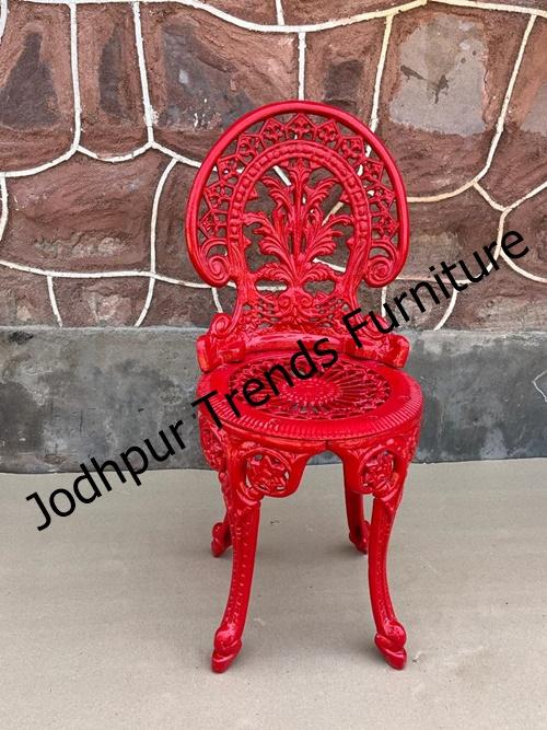 Here are a couple of images showcasing red cast iron chairs—a vibrant and trendy choice for both indoor and outdoor settings in Jodhpur. The first image features a minimalist, metal-framed dining chair in red—sleek and contemporary. The shows a more detailed, ornate mesh-back red cast iron garden chair—perfect for a classic or vintage-inspired setting.