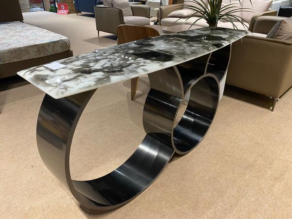 Crafted with precision and elegance, this console is a stunning piece that combines functionality with artistry. Featuring a sleek design with spacious storage, it offers both beauty and practicality for modern living spaces. The premium materials ensure strength and long-lasting durability, while the refined finish highlights its luxurious appeal. Perfect for entryways, living rooms, or dining areas, this console adds a touch of class, seamlessly blending into different interior themes with grace and sophistication.