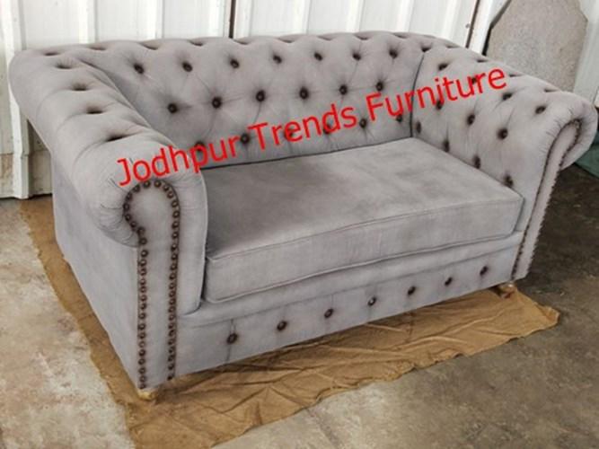 Here are some image inspirations of two-seater grey velvet sofas in different styles—from sleek midcentury designs to tufted Chesterfields. A luxurious velvet piece in iron gray — ideal as a stylish centerpiece with a neutral yet refined appearance. Offers a cozy, inviting feel with plush cushions, built on neem wood for durability and includes throw
