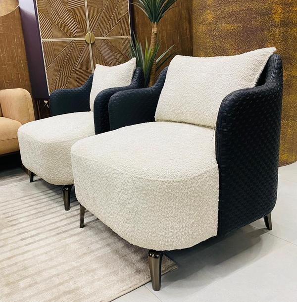 This 2-piece leisure chair set, crafted in-house, combines elegance with comfort for modern living. Upholstered in premium fabric with a soft greyish tone, these chairs showcase refined design and durable construction. Perfect for cozy corners, lounges, or living areas, they provide ergonomic support with timeless style. Built by in-house experts, this set highlights quality, comfort, and affordability, making it an ideal choice for those who seek both functionality and sophistication in their home interiors.