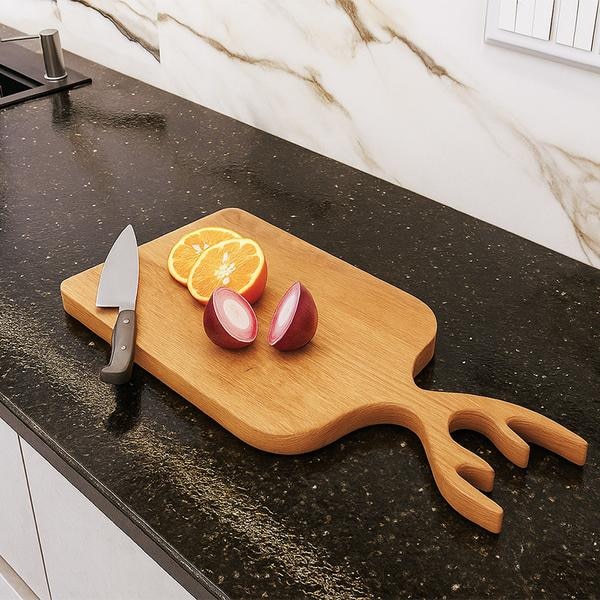A durable wooden cutting board made from premium quality Teak wood Designed with a smooth, food-safe finish, it provides a sturdy surface for chopping vegetables, fruits, bread, and meats. Its natural wood grain adds a touch of elegance to your kitchen while ensuring long-lasting performance.•Stylish design for modern and traditional kitchens•Knife-friendly surface that won’t dull blades•Origin - Made in India•Use Type - Chopping vegetables, fruits, meat, bread•Care - Hand wash only , Do not soak ,Oil regularly•Long live and heavy duty