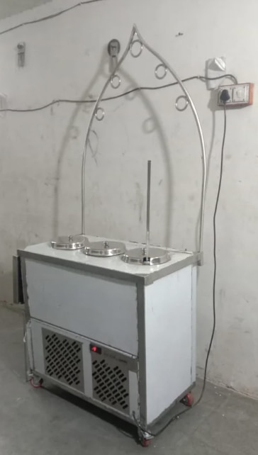 Kulfi Making Machine ManufacturersWe are also supply in Andhra Pradesh, Arunachal Pradesh, Assam, Bihar, Chhattisgarh, Goa, Gujarat, Haryana, Himachal Pradesh, Jharkhand, Karnataka, Kerala, Madhya Pradesh, Maharashtra, Manipur, Meghalaya, Mizoram, Nagaland, Odisha, Punjab, Rajasthan, Sikkim, Tamil Nadu, Telangana, Tripura, Uttar Pradesh, Uttarakhand, and West BengalA Kulfi Making Machine is a specialized refrigeration unit designed to produce traditional kulfi and ice-candy in bulk quantities with high efficiency. Built with food-grade stainless steel and advanced cooling technology, the machine ensures hygiene, uniform freezing, and consistent product quality.Key FeaturesConstruction: Food-grade SS 304 / SS 316 body for durability and hygiene.Mould Capacity: Available in 2, 4, 6, 8, 12 mould trays (100–500 kulfi per batch).Freezing System: Brine-based indirect cooling with rapid temperature pull-down.Compressor: Hermetically sealed Emerson / Kirloskar compressor.Refrigerant: Eco-friendly R404A / R134A refrigerant.Temperature Range: –18°C to –35°C (adjustable digital control).Insulation: High-density PUF for minimum thermal loss.Operation: Semi-automatic / Fully automatic with digital thermostat.Power Supply: Single-phase 220V / Three-phase 380V.Batch Time: 15–25 minutes depending on model & load.Output Capacity: 100 – 500 kulfi sticks per batch (varies by Mould size).