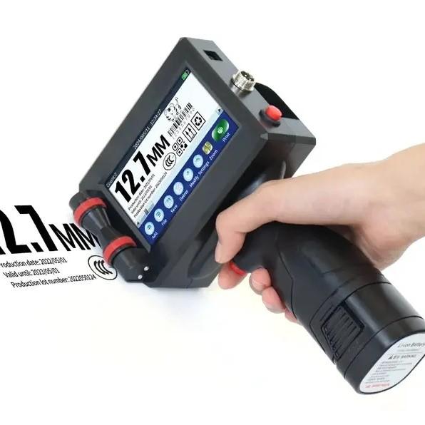 ### **Description:**A handheld inkjet printer is a portable device used for printing directly on various surfaces like paper, plastic, metal, wood, cartons, pipes, bottles, and more. It is commonly used in manufacturing and packaging industries for **batch coding, barcodes, QR codes, logos, expiry dates, serial numbers, and product details**.### **Key Features:*** **Portable design** – Lightweight and easy to carry.* **High-resolution printing** – Usually up to 600 DPI.* **Print height** – Adjustable, often around 12.7mm (as shown on the display).* **Touchscreen operation** – User-friendly interface for editing text, barcodes, or logos.* **Multiple ink options** – Can use quick-dry inks (black, white, yellow, UV, etc.) for different surfaces.* **Connectivity** – USB or wireless support for uploading logos and batch details.* **Rechargeable battery** – Provides mobility and continuous printing without power supply.### **Applications:*** Food & beverage packaging* Pharmaceutical & cosmetic products* Electrical and PVC pipes* Carton boxes & shipping labels* Industrial components👉 This is essentially a **Portable Industrial Inkjet Coding Printer** widely used for **batch marking, expiry printing, and labeling**.