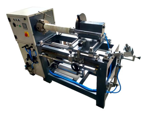 The Rewind and Semi-Automatic Slicing Machine from Trasy Enterprises is purpose-built for precise cutting and rewinding of adhesive tapes, protective films, fabrics, nonwoven materials, and other roll-stock substrates. Designed for reliability and ease of use, it ensures smooth cutting surfaces with high efficiency, making it an ideal solution for manufacturers seeking consistent quality with minimal maintenance.Key FeaturesUser-Friendly Operation – Simple, manual cutting system ensures ease of use with high cutting efficiency.Powder Brake for Unwinding – Provides stable tension control for smooth operation.Circular Blade with Pneumatic Feeding – Guarantees clean, smooth, and accurate cuts.Cutting Width Gauge – Enables quick and stable positioning for precise cutting widths.Compact & Low-Maintenance Design – Small footprint with simple maintenance, offering both economy and efficiency.Technical SpecificationsEffective Width: 310 mmMaximum Unwinding Diameter: 550 mmMaximum Cutting Diameter: 180 mmCutting Width Range: 25 – 300 mmCore Inner Diameter: 3’’Motor Power: 1 HPTotal Power Consumption: 1.5 kW