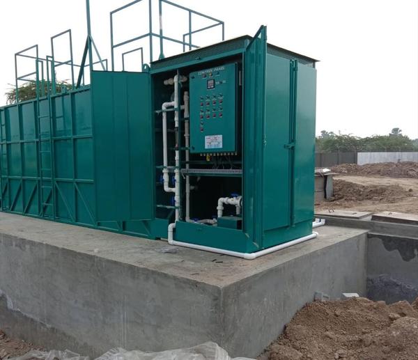 An MBR STP plant is a Sewage Treatment Plant that uses Membrane Bioreactor (MBR) technology to combine biological treatment with membrane filtration, producing high-quality, reusable treated water. The process involves microorganisms breaking down waste in a bioreactor and then passing the mixture through microfiltration or ultrafiltration membranes, which physically block suspended solids, bacteria, and pathogens, leaving behind clean water. MBR STPs are known for their compact design, ability to treat challenging wastewater, and production of high-quality effluent suitable for sensitive discharge or reuse applications.Key advantages of MBR technologySuperior effluent quality: The membrane filtration produces very clean, clear, and virtually pathogen-free water that meets stringent environmental discharge standards. This high-quality water is also ideal for reuse in non-potable applications like irrigation, toilet flushing, and cooling towers.Reduced footprint: MBR plants are significantly more compact, requiring 50–70% less space than conventional STPs because they eliminate the need for large, secondary clarifier tanks. This makes them ideal for urban areas with limited space.Less sludge production: Due to the system's long sludge retention time, MBRs generate less excess sludge, which reduces disposal costs and handling requirements.Modular and scalable design: The plants are modular, allowing for easy expansion as treatment capacity needs increase.Automated operation: Advanced automation and monitoring reduce the need for constant on-site operator supervision, which lowers labor costs and ensures consistent performance. 