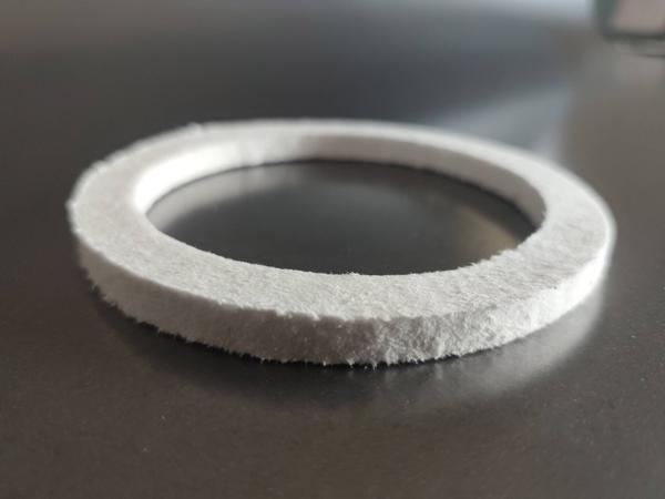 Product Description:The Ceramic Fiber Gasket Ring is a high-performance sealing solution designed for furnaces, ladles, and aluminium/steel casting applications. Manufactured from high-purity ceramic fiber, it provides excellent thermal insulation, low heat conductivity, and resistance to temperatures up to 1260°C.Its ring-shaped design ensures a secure, leak-proof seal in high-temperature environments, making it ideal for flow control, refractory lining, and industrial furnace operations. The gasket ring is lightweight, durable, and easy to install, offering long service life and improved operational safety.At Kumaran Shapes and Gasket, we are proud to be among the only manufacturers in India producing specialized ceramic fiber gasket rings in custom sizes for critical industrial applications.✅ Key Features:High-purity ceramic fiber constructionWithstands up to 1260°CExcellent sealing & insulation performanceResistant to thermal shock & molten metal splashLightweight, durable & easy to handleAvailable in custom sizes & graphite-coated options