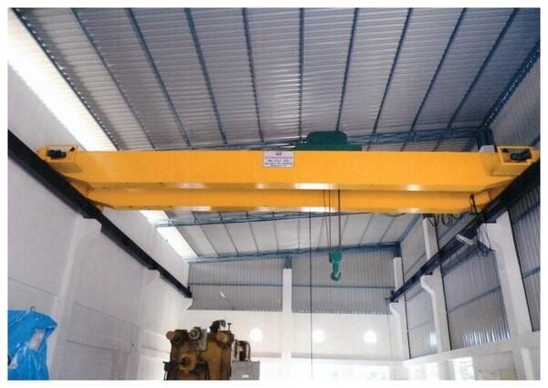 A double girder Electric Overhead Traveling (EOT) crane features two main bridge beams to support a trolley and hoist, offering higher lifting capacities and greater vertical space for heavy-duty industrial applicationsKey components include the two main bridge girders, end carriages, a trolley with one or more hooks (main and auxiliary), and travel mechanisms for the trolley and crane. These cranes are built for superior durability, smooth, precise movement, and enhanced safety, with typical capacities ranging from 5 to over 500 tons