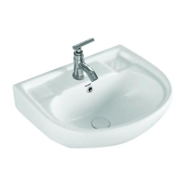 The wash basin is made of ceramic. It is designed for use in a bathroom.