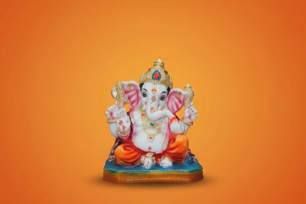 Brighten your space with this Vibrant Multicolor Ganesha Idol (8.5 Inch) featuring an eye-catching combination of orange, blue and gold, paired with a glossy painted finish. The rich detailing on the crown and attire enhances its divine presence and festive appeal.Made from washable marble material, this murti is durable and easy to maintain. Its stable base allows it to be placed comfortably in home temples, living rooms, office desks, and showcase shelves.Lord Ganesha is shown in a blessing posture with symbolic elements that represent protection, prosperity and wisdom, making it an ideal décor piece for any spiritual setup.Product Details:Height: 8.5 inchesWidth: 7 inchesDepth: 4.5 inchesMaterial: Washable marbleFinish: Glossy painted finishIdeal for: Home temple, festive decor, spiritual giftingA perfect choice for gifting during festivals like Ganesh Chaturthi and Diwali, as well as housewarmings, anniversaries and new beginnings.