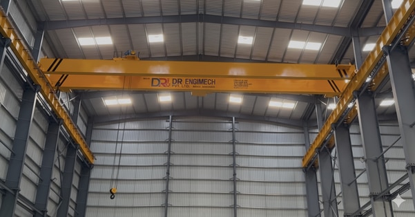 The 15 Ton Double Girder EOT Crane by D.R .Engimech Pvt. Ltd. is designed for heavy-duty material handling with superior strength and efficiency. It features dual girders for enhanced load stability and greater lifting height, ideal for workshops, warehouses, and industrial plants. Equipped with a heavy-duty hoist and motorized movements for hoisting, cross-travel, and long travel, it ensures smooth, safe, and precise operations. Built from high-grade steel and tested for durability, it includes advanced safety features like overload protection and limit switches. A reliable, customizable, and performance-driven solution for demanding industrial applications.