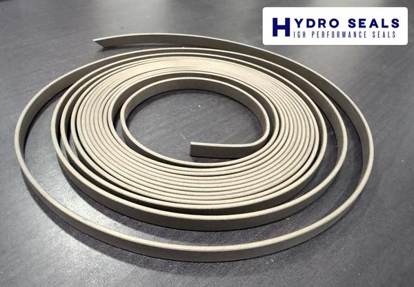 Guide Tape (PTFE + Bronze)PTFE + Bronze Guide Tapes are precision-engineered bearing and guiding elements used in hydraulic cylinders to support piston and rod movement while preventing metal-to-metal contact. The addition of bronze filler enhances wear resistance, load capacity, and thermal conductivity, ensuring smooth and efficient cylinder operation.Key Features & Benefits:Low Friction & High Strength: PTFE with bronze filler ensures smooth movement and excellent wear resistance.Prevents Metal Contact: Protects cylinder components from scoring and damage.High Load & Temperature Capability: Suitable for demanding hydraulic applications.Chemical & Oil Resistant: Compatible with most hydraulic fluids and lubricants.Easy Installation: Available in standard widths and thicknesses for piston and rod guides.Applications:Hydraulic and pneumatic cylindersPresses and injection molding machinesMobile and construction equipmentIndustrial and marine hydraulics