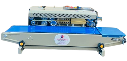 High Speed MS Horizontal Continuous Band Sealer with Nitrogen Flushing System for Automatic Pouch Sealing of Namkeen and Fried Items Pouch Packaging for enhancing shelf life of Products and making pouch fluffy like wafers pouches. 