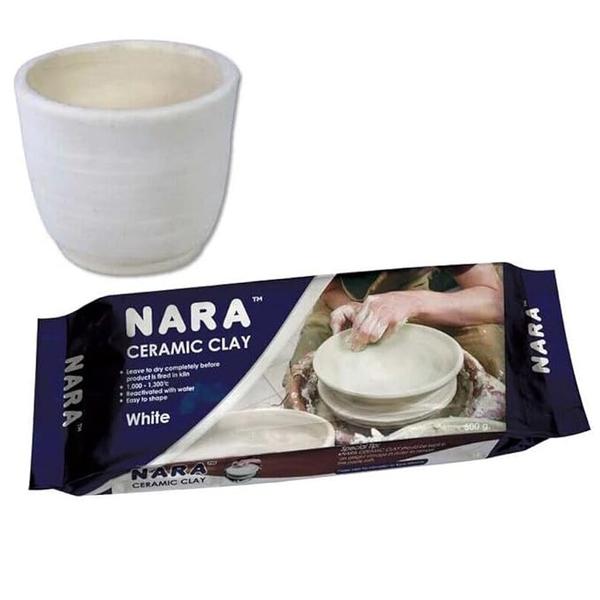 Nara Ceramic Clay 500 Grams of White Colour
White Ceramic Clay 500g, Premium Natural Kiln-Fire Clay for Pottery, Hand Sculpting & Ceramic Art, Soft, Smooth & Artist-Grade Clay Range of Natural Colors: Available in white, grey, and terracotta.

Effortless Use: NARA Ceramic Clay is crafted for smooth, easy handling—perfect for both beginners and professional artists. Its fine texture is easy to mold and shape with minimal resistance, offering excellent control over your designs. 

Kiln-Fire Only Clay: Unlike air-dry clay, NARA Ceramic Clay must be kiln-fired to harden and become permanent. It offers superior strength and finish once bisque fired and glazed—ideal for durable, long-lasting ceramic pieces. 

Multi-Purpose Use: Suitable for wheel throwing, hand-building, coiling, and sculpting, this clay is perfect for making functional pottery, decorative art, miniatures, and more. Great for art studios, schools, or home craft use. 
White gives a clean, modern look, grey offers a subtle sophistication, and terracotta provides a rustic, earthy tone—perfect for a variety of artistic styles.