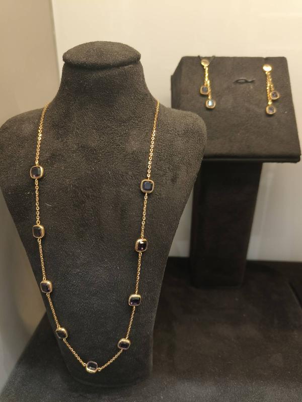 18 karat Rose Gold light weight set with Blue color semi precious stones.