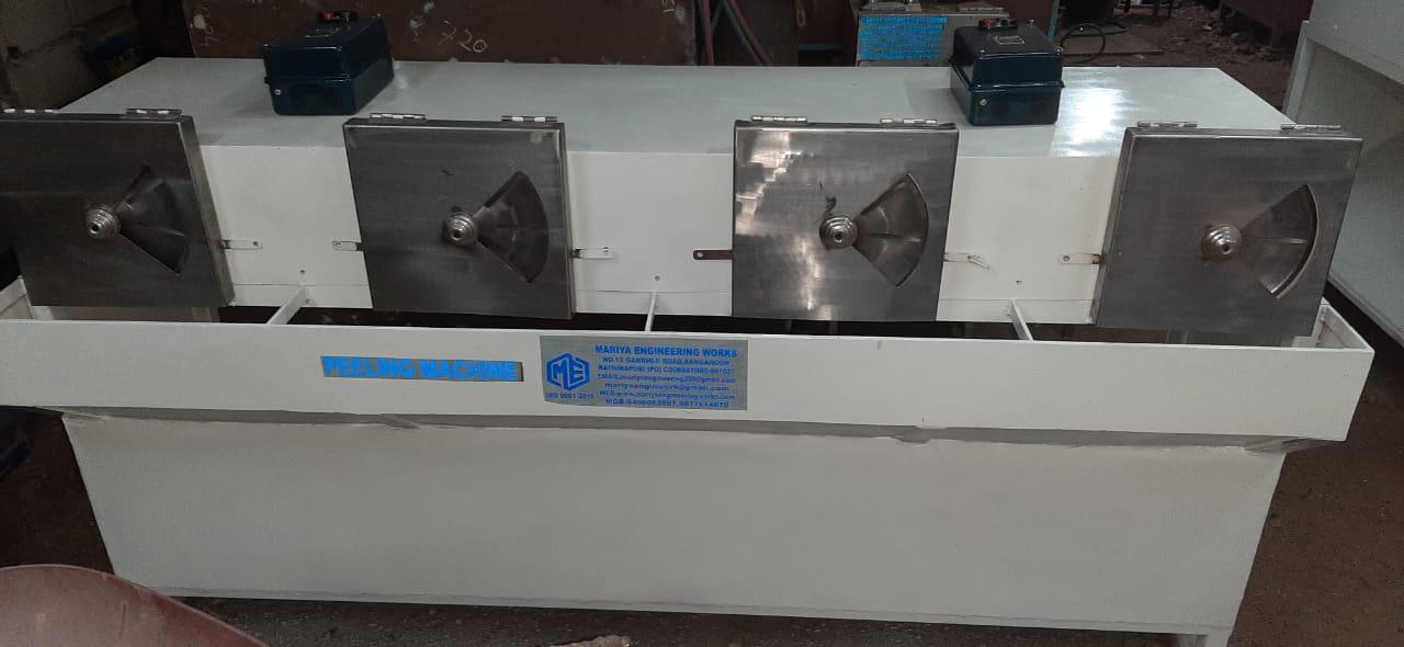 A Four-Station Coconut Testa Remover (or Coconut Peeling Machine) is a semi-automatic industrial machine designed to remove the thin brown skin—called the testa—from the white coconut kernel after the husk and hard shell have already been removed. In this machine, four peeling stations operate simultaneously, allowing multiple operators to work at once or allowing several kernels to be processed in parallel, which significantly increases the overall output. Each station typically contains a high-speed friction wheel or abrasive roller lined with emery cloth or sandpaper. When the deshelled coconut kernel is pressed gently against the rotating abrasive surface, the brown testa layer is uniformly scraped off, leaving clean white coconut meat suitable for further processing such as desiccated coconut, virgin coconut oil, coconut chips, or other value-added products
