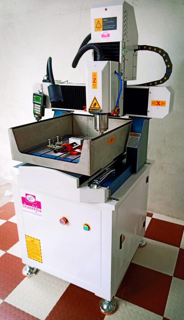 Gold engraving CNC Router machine In Coimbatore| SAREKHA CNC SAREKHA CNC Gold Engraving CNC Router Machine is a high-precision engraving solution specially designed for gold, silver, brass, copper, aluminium, and soft metals. This machine is widely used in jewellery manufacturing, gold nameplate engraving, temple ornaments, coins, medals, and decorative metal products. With advanced CNC control and micron-level accuracy, it ensures clean, detailed, and consistent engraving results.As a trusted Gold Engraving CNC Router Machine Manufacturer in India, we supply machines built with rigid structures, high-speed spindles, and superior motion control for long-term performance.