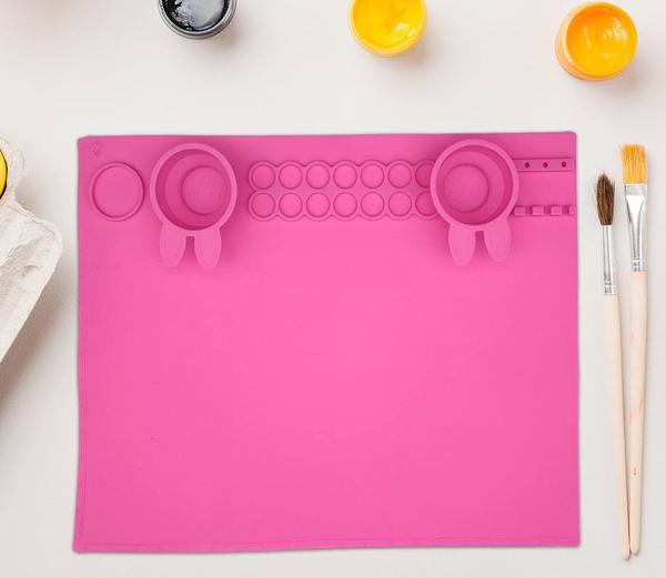 Silicone Painting Mat with Brush Holders for Crafts with Bunny Cups
silicone drawing mat with 2 silicone cups in the shape of rabbit. These brush cleaning cups are always at hand conveniently located on the silicone coloring mat. painting mat has 14 small circles for mixing paints and one big circle - this quantity is enough to meet all your paint mixing needs .Upgraded silicone mat for painting has 2 collapsible cups that can clean the brushes twice at once and make brush more cleaner.
Silicone painting mat with cup is made from waterproof and soft silicone material which makes them not easy to fade providing a long service time. The material of paint mat is non-stick, non-skip, flexible and heat resistant. Multifunction silicone craft mat with cup and paint holder is washable and can be cleaned with a cloth.
Keep your workspace clean with this painting station mat for kids. The mat for arts and crafts has an attractive bunny design and helps develop freshers passion for drawing. This paint silicone mat is great for paint, watercolor, resin casting mold, making jewelry, paper crafting, DIY and other craft projects.
Made of 1 silicone, Non-stick and non-skip, waterproof, easy to clean, ideal for protecting table from messy crafts, heat tools, glue and more, this paint mat makes cleaning up so much easier, good choice art mat for beginners and artists alike .This paint silicone mat is great for paint, watercolor, resin casting mold, making jewelry, paper crafting, DIY and other craft projects
