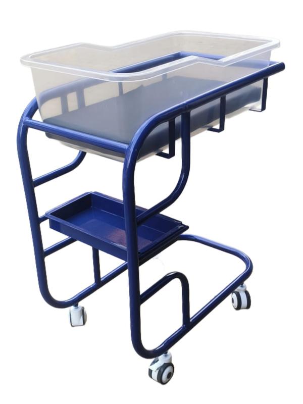 Specifications – Frame & ConstructionMaterial: Mild Steel (M.S.) tubular frame with pretreatment and epoxy powder coating for corrosion resistance and durability (similar to hospital-grade bassinet standardsFinish: Smooth, easy-to-clean surface.Load Capacity: Designed to safely support a newborn and mattress (typically ~15–20 kg working load – confirm from your supplier).Bassinet TopImported Top Material: Transparent acrylic or polycarbonate top for clear visibility and ventilation.Safety Design: Rounded edges and sufficient side height to prevent rolling out.MattressIncluded: Padded mattress fitted precisely to the bassinet shape.Material: High-density foam with washable, waterproof cover for hygiene and comfort (common in baby bassinets). Gentek MedicalWheels (To-Win Wheels)Type: To-Win branded smooth-rolling caster wheels (commonly used in medical/nursery furniture for easy mobility).Configuration: 4 wheels with 2 lockable brakes to secure the bassinet in place during use.Mobility: Swivel castors for easy steering.DimensionsOverall (Approx.): ~L 800 mm × W 450 mm × H 900 mm (example hospital bassinet size) Gentek MedicalBassinet Tray Size: ~700 mm × 400 mm × 250 mm (approx.) Gentek MedicalHospital  Furniture Manufacturer in India/Gurgaon/Delhi NCRBest Medical furniture supplier/Manufacture in Gurgaon/Delhi NCRHospital Medical Equipments supplier/Manufacture in Gurgaon/Delhi NCR