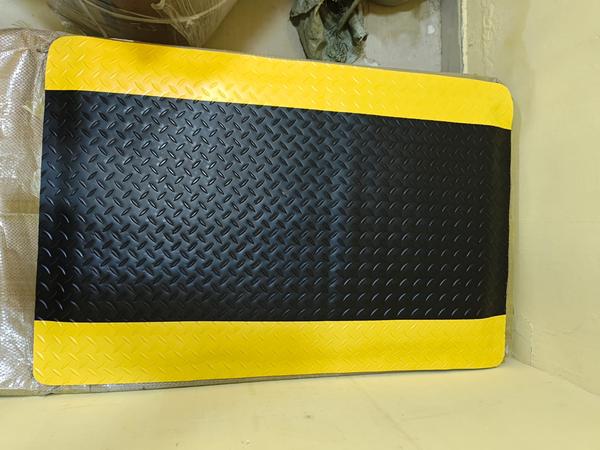 ESD Anti fatigue matProduct specification:Material     - PVC & EPDM FoamThickness - 20 MmTexture      - Industrial Diamond PlateColor          - Black and YellowESD Type   - Surface 10e6-10e9 ohms                      Bottom 10e4-10e6 ohmsFeatures•3 layer constructure, surface pvc material, middle layer is EPDM, Bottom is PVC Material. •Designed specifically to reduce fatigue as a standing surface. •Provides good anti fatigue properties, improving worker comfort. •Slip resistant and soil resistant heavy embossed texture. •Safe surface for workers, mat stays clean. •Durable top wear layer. •Non-Humidity depenence. •Dimensionally stable. •Minimal shrinkage and curling. •Provides consistent electrical performance regardless of ambient humidity. Applications•Manufaturing plants•Assembly lines•Packing & Logistics warehouses•Individual workstations•Reception desks•Shop counters•Department stores•BanksIndustriesAviation, power, warehousing& logistics, automotive, beauty & saloon, institutions, restaurant & kitchen