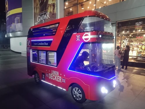 DOUBLE DECKER ELECTRIC LONDON BUS MANUFACTURERLONDON BUS MANUFACTURERMaterial	                     -     FRPCapacity	                    -      18 PersonUsage/Application	-      Amusement ParkType	                        -      ElectricColor	                        -      RedPower	                        -      100WVoltage	                    -      150VDouble Decker Electric London Bus by YAAN WorldExperience the charm of the United Kingdom with YAAN World’s Double Decker Electric London Bus. Designed specifically for amusement parks, luxury resorts, and large-scale shopping malls, this iconic red bus combines classic British aesthetics with modern, eco-friendly electric technology.Key Features:Capacity: Accommodates up to 18 passengers (Adults/Kids), making it perfect for family sightseeing and group shuttles.   Build Quality: Crafted with a premium Fiberglass (FRP) body for superior durability, weather resistance, and a high-gloss finish.   Eco-Friendly Performance: 100% electric and zero-emission, featuring a silent 150V/100W motor system that ensures a smooth, noise-free ride for your guests.Vibrant Aesthetics: Finished in the signature London Red, it acts as an instant landmark and photo-op for any venue.   Whether you are looking to enhance your park’s transportation or add a unique attraction to your fleet, the YAAN World London Bus offers a safe, reliable, and visually stunning solution.Bring the spirit of London to your venue today!