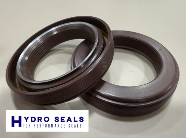 A cassette seal is an advanced rotary shaft sealing system that combines:Integrated seal lip systemWear sleeve / casing arrangementMultiple sealing barriers (primary & secondary)Labyrinth / contamination protection designThis construction provides long-lasting sealing in conditions where standard oil seals fail due to contamination, vibration, or shaft wear.APPLICATION:Wheel hubsAxles & final drivesGearboxesTransmission systemsHeavy-duty rotating shaftsKey Benefits of Cassette SealsCassette seals are widely preferred because they offer:Excellent sealing against mud, dust, and water ingressExtended seal life even in abrasive environmentsBetter reliability in high vibration equipmentReduced shaft wear with integrated sleeve designLow maintenance and minimized downtimeImproved equipment life and performanceMaterials & ConstructionCassette seals are manufactured using high-performance materials such as:NBR / HNBRFKM (Viton®) for high temperatureMetal casing & reinforcing ringsSpecial coatings for wear resistance (depending on design)Cassette seals are commonly used in:Construction equipment (excavators, loaders, dozers)Mining machineryAgricultural equipment (tractors, harvesters)Truck hubs, trailers & commercial vehiclesOff-road and earth-moving systemsHeavy-duty industrial drives