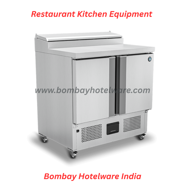 The Sandwich Preparation Table is a heavy-duty commercial refrigeration and food prep solution designed for sandwich outlets, restaurants, cafés, cloud kitchens, hotels, and fast-food chains. Built with robust stainless steel construction and static cooling technology, this unit ensures efficient cooling, hygienic food storage, and smooth preparation workflow in professional kitchen environments.This commercial sandwich prep table combines a refrigerated base with a spacious worktop, allowing ingredients like cheese, vegetables, sauces, and dough to be stored at safe temperatures while preparing sandwich quickly. Engineered for continuous use, it offers consistent cooling performance and easy access during peak service hours.As a trusted supplier of heavy duty kitchen equipment, commercial refrigeration systems, durable hotelware utensils, and fancy crockery, we provide the Sandwich Preparation Table in Nagpur with supply across India, suitable for high-volume food operations and institutional kitchens.Product Specifications:External Dimensions: 900 (W) × 700 (D) × 1056 (H) mmGross Volume: 270 LitersPower Supply: 230V AC / 50HzNo. of Shelves: 4 Shelves (Coated)Temperature Control Range: –2°C to +8°CCooling Type: Static CoolingMobility: Mounted on castor wheels for easy movementDesigned for durability, easy cleaning, and energy-efficient performance, this pizza prep table enhances productivity while maintaining food freshness and hygiene standards.tags:Pizza Preparation Table, Commercial Pizza Prep Table India, Refrigerated Preparation Table for Restaurant, Heavy Duty Kitchen Equipment Supplier India, Pizza Counter Refrigerator Nagpur, Hotel Refrigeration Equipment India, Food Prep Table for Cloud Kitchen