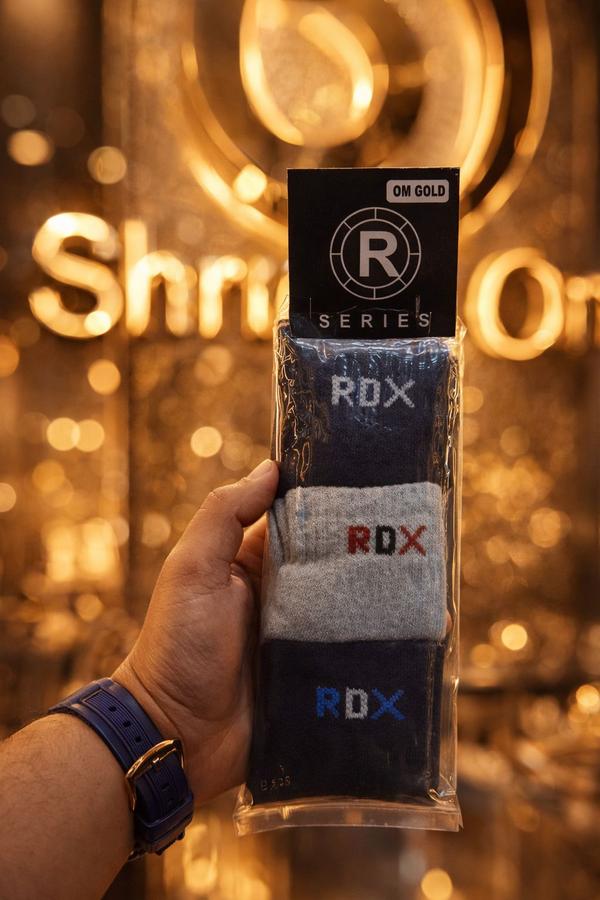 RDX Socks – Power Comfort PerformanceStep into strength and style with RDX Socks, designed for active lifestyles and everyday wear. Made from premium breathable fabric, these socks provide superior cushioning, moisture control, and long-lasting durability. The elastic grip ensures a snug fit without slipping, while reinforced heels and toes add extra support for intense movement. Perfect for sports, workouts, or casual use, RDX Socks deliver the perfect balance of comfort, performance, and bold design.