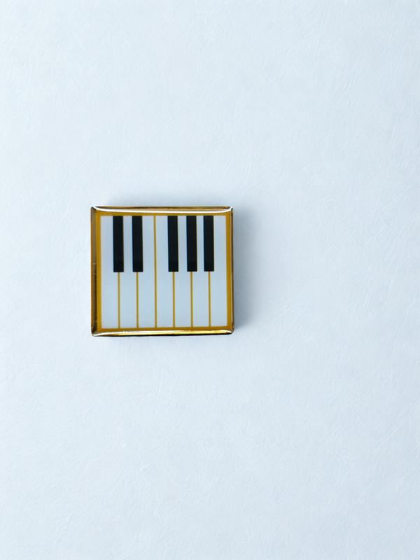 A printed square lapel pin gives off a clean, modern, and customizable feel—perfect for making a small but noticeable visual statement.