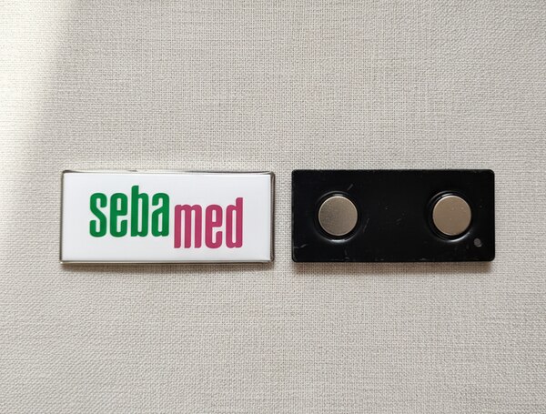 Metallic printed badge with high quality magnet. 