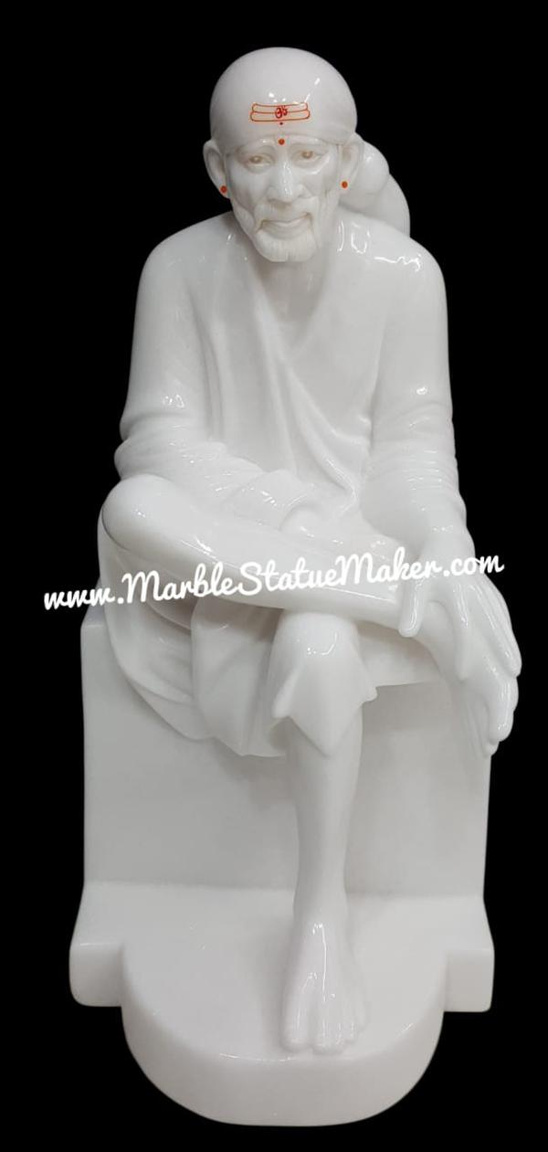 Sai Baba Murti – Symbol of Faith, Peace & Divine BlessingsBring home the divine presence of Sai Baba with our beautifully handcrafted Sai Baba Murti, a symbol of faith (Shraddha) and patience (Saburi). Sai Baba of Shirdi is worshipped by millions of devotees for his teachings of love, compassion, and unity beyond religion.Our marble Sai Baba Murti is carefully crafted by skilled artisans using premium-quality marble, ensuring a smooth finish, durability, and a lifelike appearance. The idol beautifully captures Sai Baba’s calm and compassionate expression, seated in his iconic posture, radiating peace and spiritual energy.This sacred murti enhances the spiritual atmosphere of your home, temple, or workplace. It is believed to bring blessings, positivity, and protection while guiding devotees toward a path of truth and devotion.