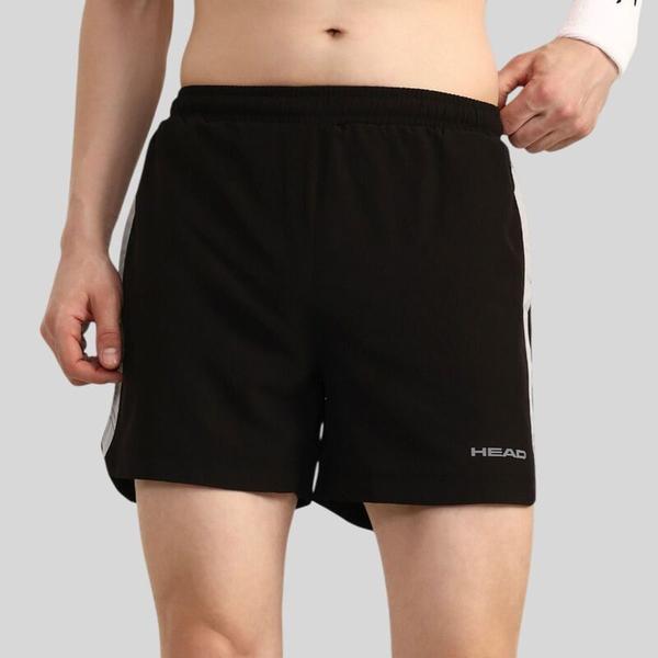 The HEAD HPS-1114 Shorts are designed using NS Lycra fabric combined with strategically placed knitted mesh inserts to enhance breathability and comfort. The moisture-wicking properties of the materials help draw sweat away from the skin, keeping players feeling dry and comfortable during intense training sessions or competitive matches. This performance-oriented construction supports unrestricted movement while maintaining a lightweight feel on the court. An elasticated adjustable waistband with an integrated drawcord ensures a secure and personalized fit. This flexible waistband design adapts comfortably to the body, allowing players to move freely during quick sprints, lunges, and directional changes without distraction. The adjustable feature provides added convenience, making the shorts suitable for both active play and everyday sportswear.For added practicality, the shorts include side hand pockets that offer convenient storage for small essentials such as tennis balls or personal items. A contrast stripe side insert enhances the overall design with a sporty and dynamic look, giving the HEAD HPS-1114 Shorts a modern aesthetic that complements their high-performance functionality. NS LYCRA FABRIC: NS Lycra fabric is designed to deliver a combination of flexibility, comfort, and durability, making it well suited for sportswear and active apparel. The fabric contains stretchable fibers that allow the material to move naturally with the body, supporting a full range of motion during physical activities. This flexibility helps athletes perform dynamic movements with greater ease and comfort. The lightweight construction of NS Lycra fabric contributes to a comfortable wearing experience, especially during extended training sessions or competitive play. Its smooth texture feels soft against the skin, reducing irritation and allowing the garment to maintain a clean and structured appearance even after repeated use.BREATHABLE KNITTED MESH: Knitted mesh inserts with wicking properties are designed to enhance breathability and moisture management in performance apparel. The open mesh construction promotes increased airflow, allowing heat to escape and fresh air to circulate throughout the garment. This ventilation helps maintain a cooler and more comfortable feel during intense physical activity. The integrated moisture-wicking properties work to draw sweat away from the skin and spread it across the fabric surface for quicker evaporation. This process helps keep the wearer dry and comfortable, reducing the feeling of dampness during training sessions or competitive play while supporting overall performance on the court.ELASTICATED ADJUSTABLE WAISTBAND: An elasticated adjustable waistband with a drawcord is designed to provide a secure and comfortable fit for active wear. The elastic waistband gently adapts to the natural shape of the body, allowing the garment to stay in place during movement while maintaining flexibility and comfort throughout physical activities. The integrated drawcord allows the wearer to easily adjust the fit according to personal preference. This feature ensures added stability during training sessions or competitive play, helping the garment remain comfortably positioned while supporting unrestricted movement.SIDE HAND POCKETS: Side hand pockets are designed to provide practical storage while maintaining the streamlined look of sports apparel. These pockets offer convenient space for carrying small essentials such as tennis balls, keys, or other personal items, making them useful during both training sessions and casual wear. The placement of the side hand pockets allows for easy access without interfering with natural movement. This functional design ensures that players can quickly retrieve or store items while staying focused on their performance and maintaining comfort on and off the court.