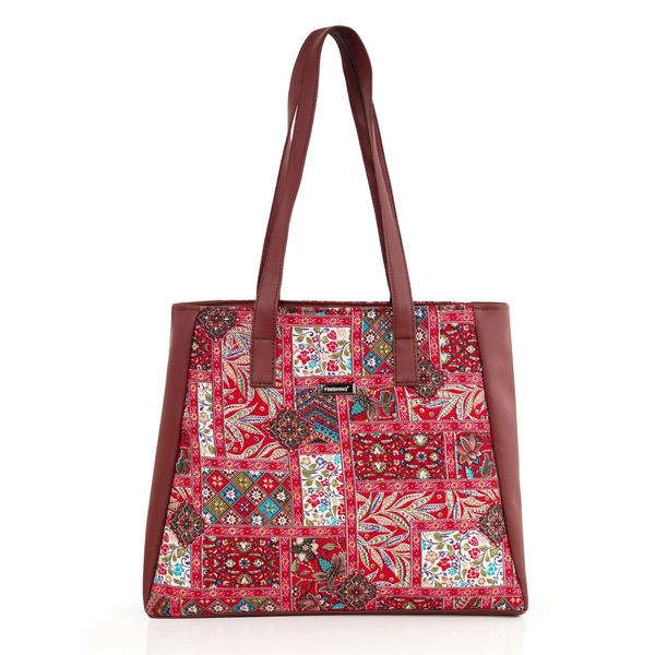 Upgrade your everyday style with this elegant and functional women’s tote handbag, designed for modern lifestyles. Crafted with premium vegan leather and beautifully handcrafted fabric, this bag blends durability with eye-catching aesthetics. The vibrant patterned exterior paired with a sleek solid top adds a sophisticated yet trendy touch—perfect for work, shopping, or casual outings.Designed with practicality in mind, this handbag features a spacious main compartment that comfortably fits your daily essentials like notebooks, tablet, wallet, and more. Inside, you’ll find a secure internal zipper pocket to keep valuables safe and organized. The back zip pocket allows quick access to frequently used items like your phone or keys, while the additional external zipper pockets enhance storage convenience.The sturdy zipper closure ensures everything stays secure, while the water-resistant inner lining protects your belongings from accidental spills. With strong dual shoulder straps, this bag offers comfortable carrying throughout the day without compromising on style.Lightweight yet durable, this tote is ideal for women who need a reliable everyday bag with a fashionable edge. Whether you're heading to the office, college, or a casual day out, this handbag delivers the perfect balance of utility and elegance.