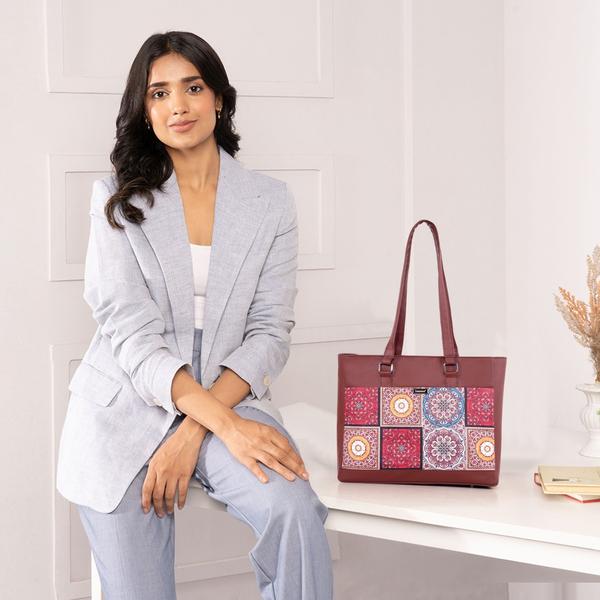Upgrade your everyday style with this elegant and functional women’s tote handbag, designed for modern lifestyles. Crafted with premium vegan leather and beautifully handcrafted fabric, this bag blends durability with eye-catching aesthetics. The vibrant patterned exterior paired with a sleek solid top adds a sophisticated yet trendy touch—perfect for work, shopping, or casual outings.Designed with practicality in mind, this handbag features a spacious main compartment that comfortably fits your daily essentials like notebooks, tablet, wallet, and more. Inside, you’ll find a secure internal zipper pocket to keep valuables safe and organized. The back zip pocket allows quick access to frequently used items like your phone or keys, while the additional external zipper pockets enhance storage convenience.The sturdy zipper closure ensures everything stays secure, while the water-resistant inner lining protects your belongings from accidental spills. With strong dual shoulder straps, this bag offers comfortable carrying throughout the day without compromising on style.Lightweight yet durable, this tote is ideal for women who need a reliable everyday bag with a fashionable edge. Whether you're heading to the office, college, or a casual day out, this handbag delivers the perfect balance of utility and elegance.