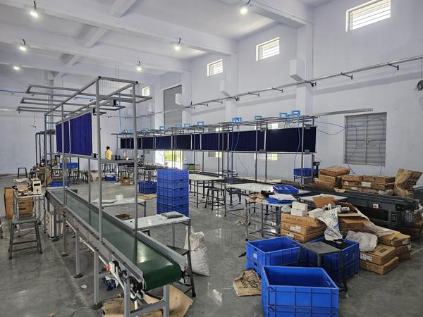 Rudra Engineering Solutions provides high-efficiency Assembly Line and Box Transfer Conveyors designed to streamline your production floor and warehouse operations. Whether you are moving lightweight parcels or heavy industrial components, our systems ensure a smooth, automated flow that reduces manual labor and increases throughput.
Key Features
Modular Versatility: Easily integrated into existing production lines or scalable for new facility layouts.
High-Precision Transfer: Designed for the stable movement of boxes, crates, and pallets without slippage or damage.
Adjustable Speed Controls: Variable frequency drives (VFD) allow for precise timing to match your assembly workers' pace.
Durable Build: Constructed with high-grade steel or aluminum frames and wear-resistant belts to handle continuous 24/7 operation.
Low Noise Operation: Engineered for a quieter workspace, improving the environment for your assembly team.