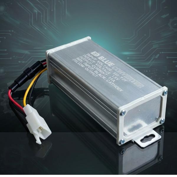 The 15A Converter with Fuse is a dependable power management unit designed to provide stable voltage conversion and enhanced electrical protection for electric vehicles and related applications. Engineered with advanced circuitry, it efficiently converts higher input voltage to a consistent 12V output, making it suitable for powering lights, horns, chargers, fans, meters, and other accessories. The built-in fuse adds an extra layer of safety by protecting the system from overloads, short circuits, and electrical faults, ensuring reliable operation and component safety. Its durable aluminum body with heat-dissipating design helps maintain cool and stable performance during continuous use. The compact structure and pre-wired connector support quick installation and easy integration into vehicle electrical systems. Ideal for electric scooters, e-bikes, rickshaws, utility vehicles, and custom EV projects, this converter improves accessory efficiency and system reliability. With low maintenance needs, rugged construction, and trusted protection features, it is an ideal solution for modern electric mobility power systems.