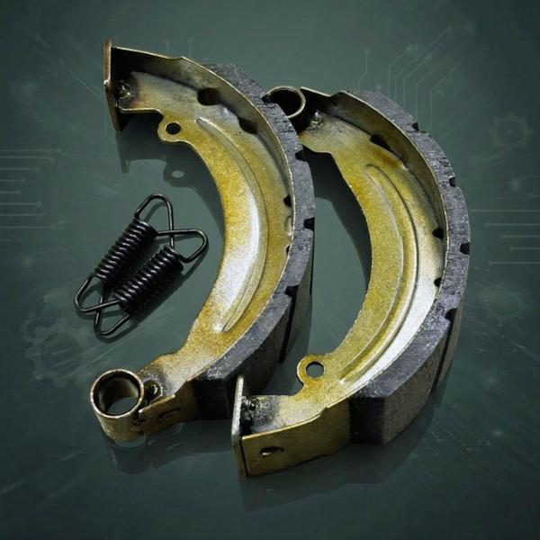 The 180mm High-Performance Brake Shoe Set is a premium safety component engineered to deliver superior stopping power and consistent mechanical reliability. Designed specifically for heavy-duty drum brake systems, these shoes feature a precision-molded architecture that ensures an exact fit and seamless integration. The core of the product is its high-density friction lining, which is formulated to withstand extreme thermal stress, preventing brake fade during prolonged use or steep descents. This advanced material composition provides a firm, immediate grip while maintaining a low-noise profile, effectively eliminating the harsh vibrations and squealing often associated with inferior aftermarket parts. Durability is central to the design; the reinforced alloy frame is treated with a corrosion-resistant coating to protect against road salt, moisture, and debris, ensuring the structural integrity remains uncompromised over thousands of miles. Included in the set are two high-tensile return springs, which are crucial for maintaining the correct clearance between the shoe and the drum. These springs prevent unwanted brake drag, which not only improves fuel efficiency but also significantly extends the service life of the entire braking assembly. The grooved surface pattern on the lining further enhances performance by facilitating the rapid dissipation of heat and the expulsion of dust, ensuring a clean contact patch in both wet and dry conditions. Ideal for professional maintenance and performance upgrades, this 180mm brake shoe set represents a critical investment in vehicle safety, offering drivers the confidence of a responsive and predictable braking response every time the pedal is engaged.